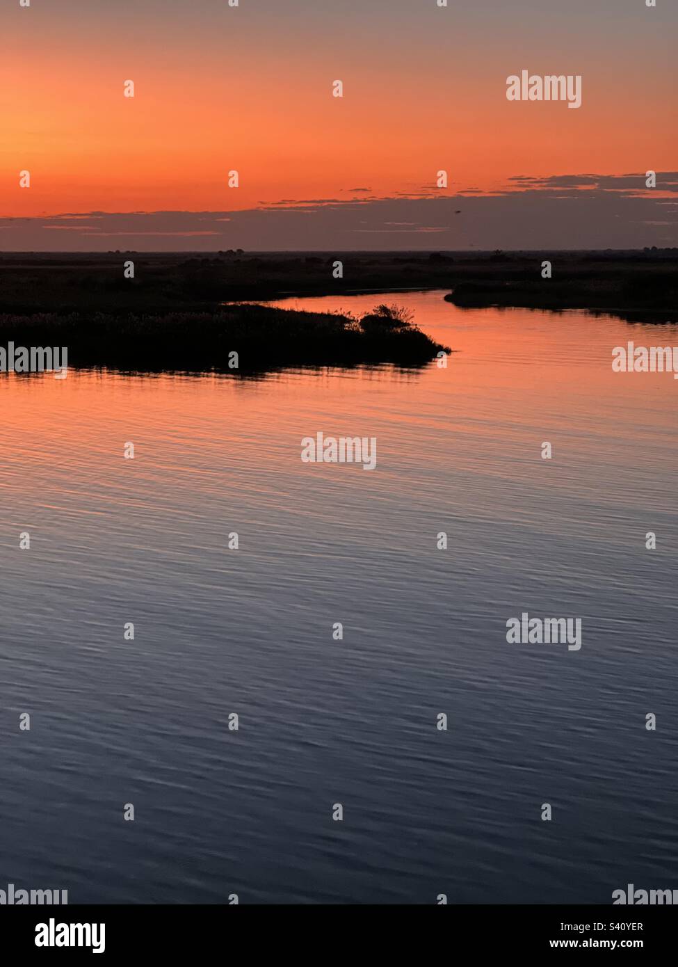 Deep red sunset at Chobe River, Botswana - Smartphone Captured Stock Image