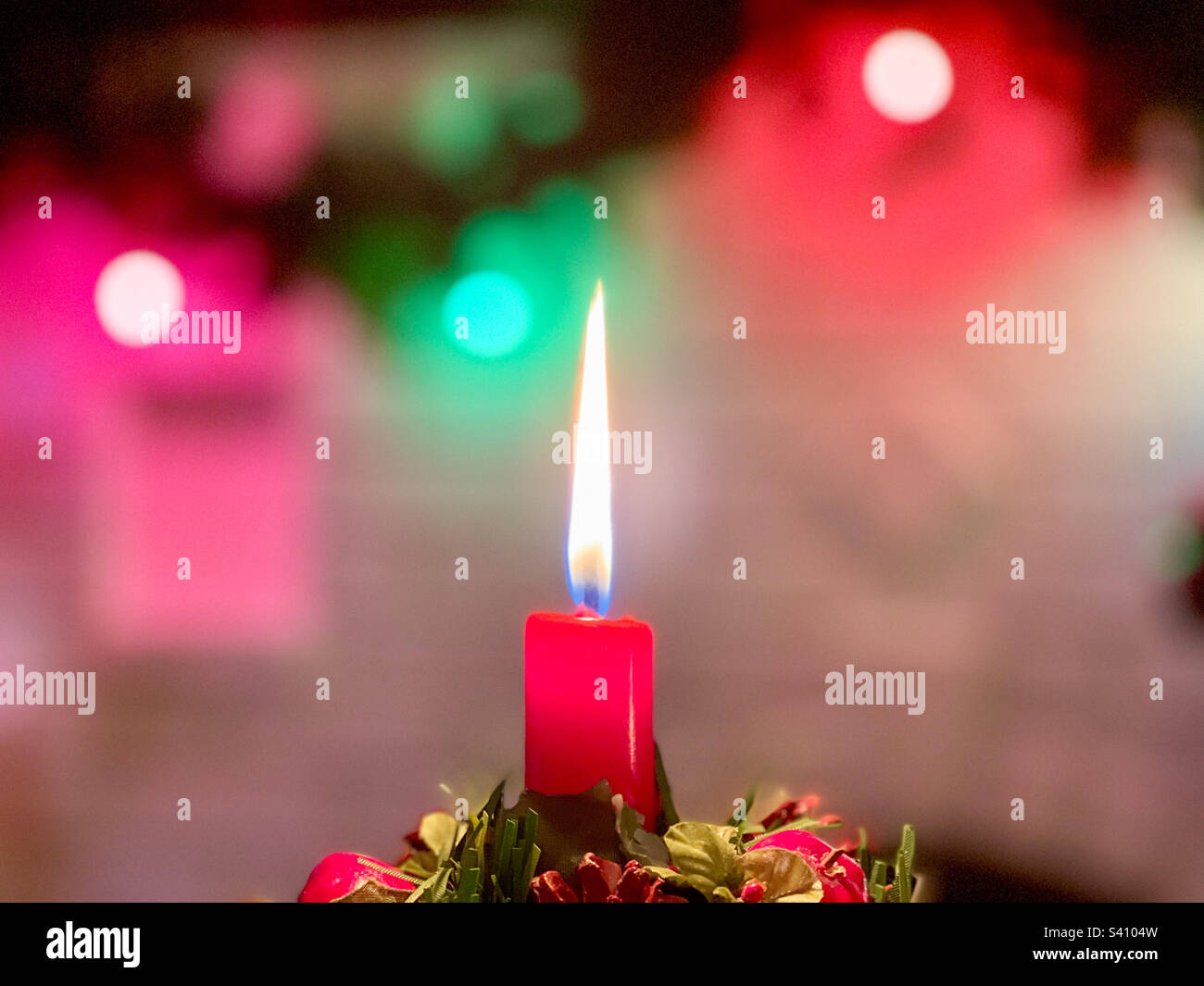 Candle & Christmas lights. Stock Photo