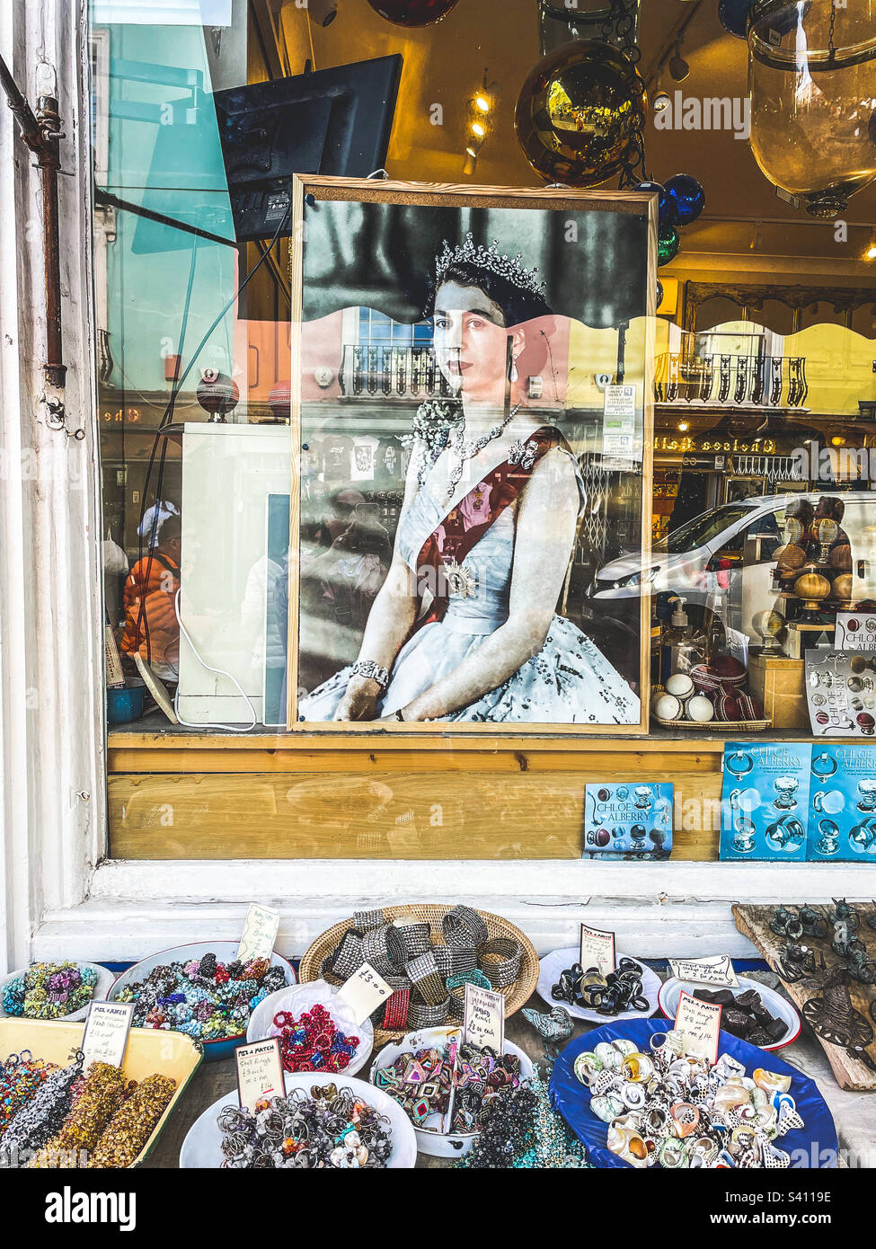 The Queens picture in a Portobello road, London, shop window - Smartphone Captured Stock Image
