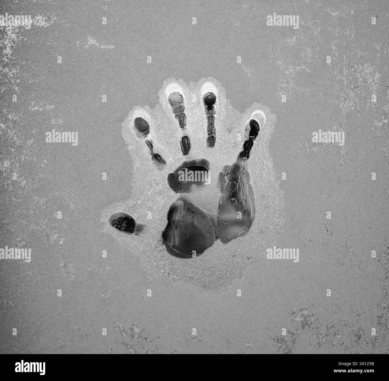 Hand imprint on a frost covered window. - Smartphone Captured Stock Image