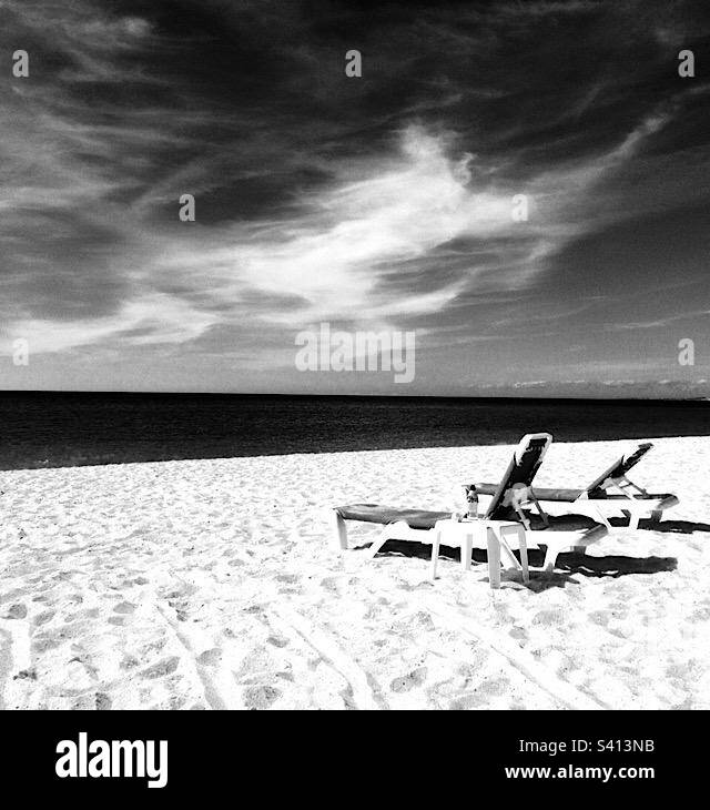 White beach chairs at the beach Black and White Stock Photos & Images ...