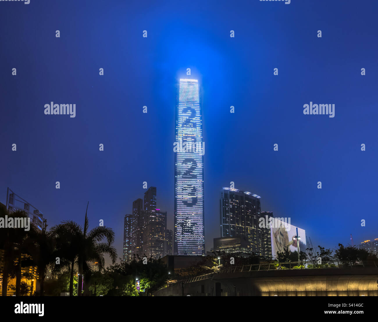 The ICC (International Commerce Centre) Tower in West Kowloon, Hong Kong, lit up to celebrate the New year 2023 - Smartphone Captured Stock Image