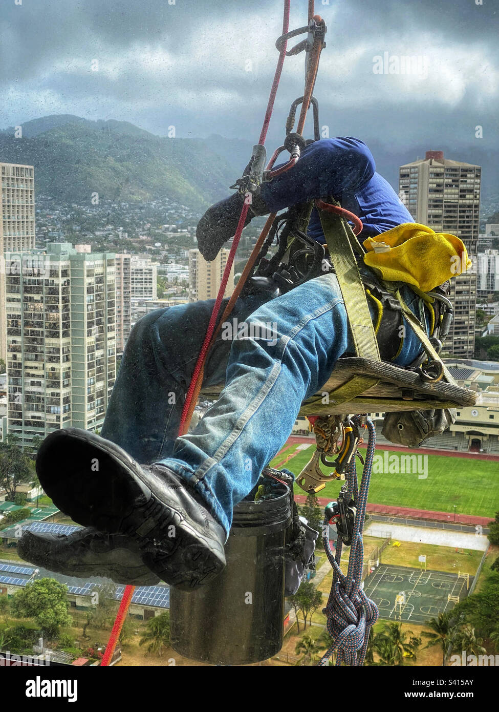 Window washer at work on a high-rise building Stock Photo
