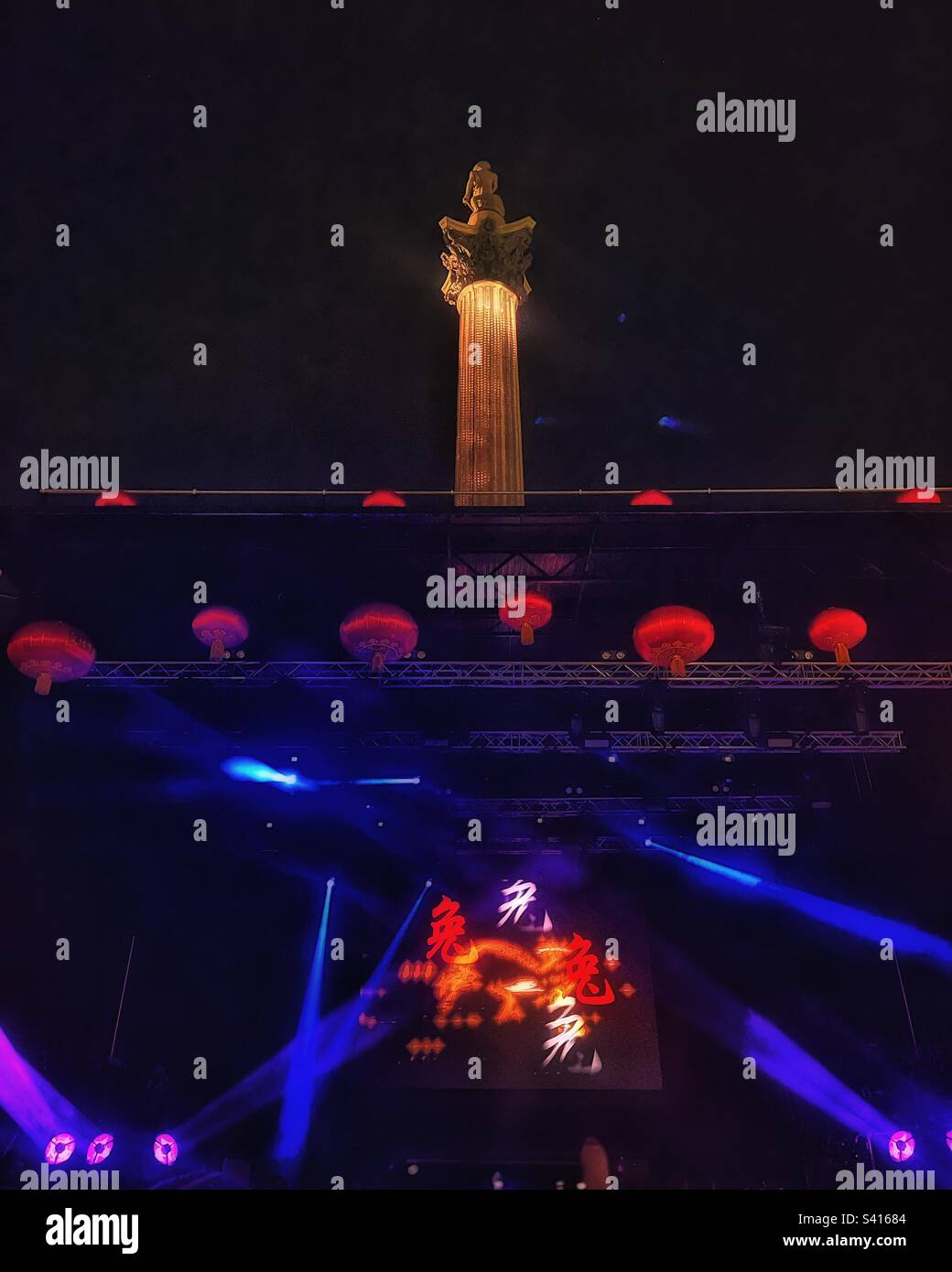 The stage is set for the Chinese New Year finale in Trafalgar Square, London with an illuminated Nelson’s Column in the background - Lunar New Year 2023 - Smartphone Captured Stock Image