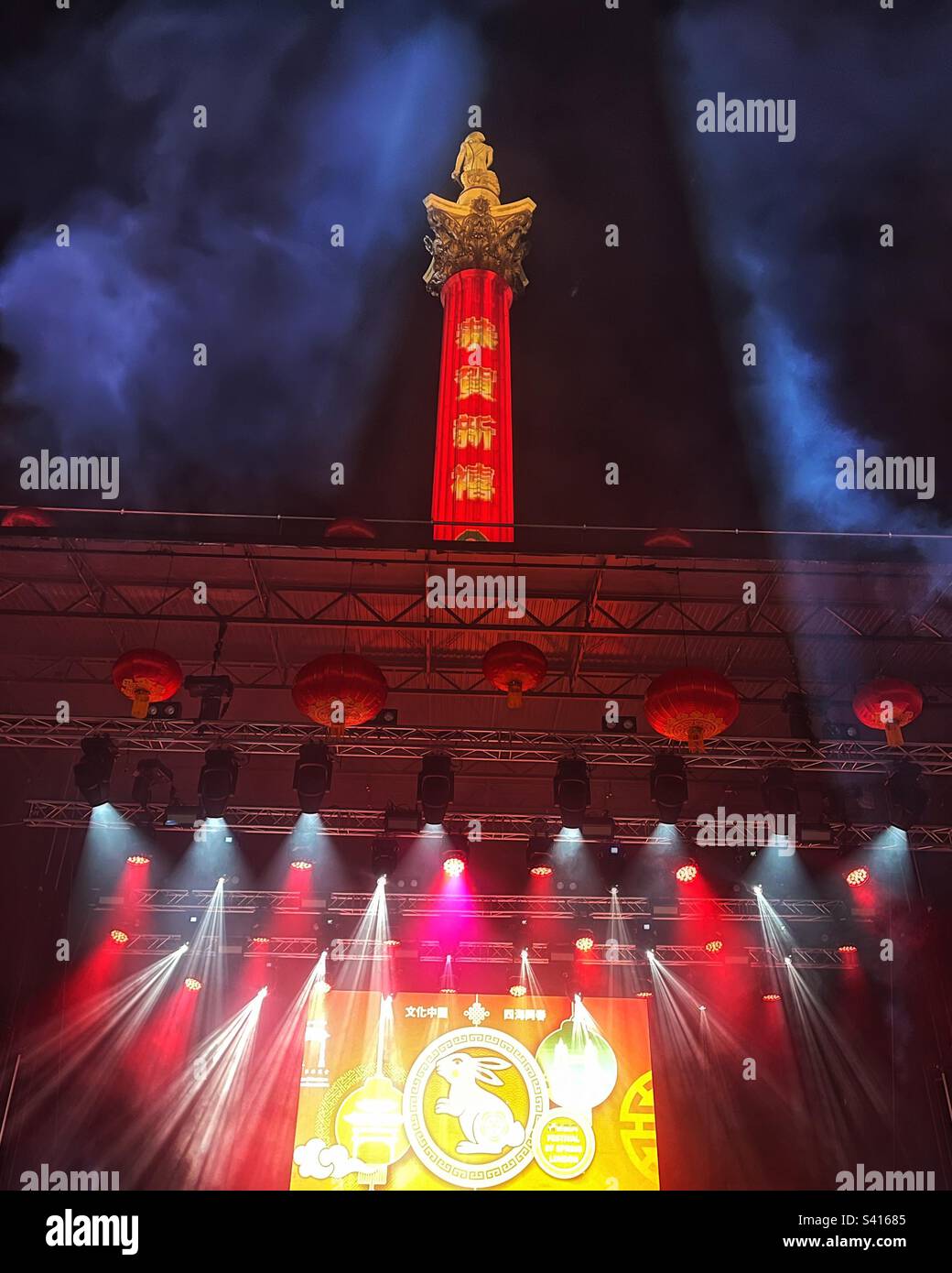 Stage with rabbit projection for the Lunar New Year, Chinese New Year of the Rabbit in London’s Trafalgar Square with message on Nelson’s Column - London Chinatown Chinese Association event. - Smartphone Captured Stock Image