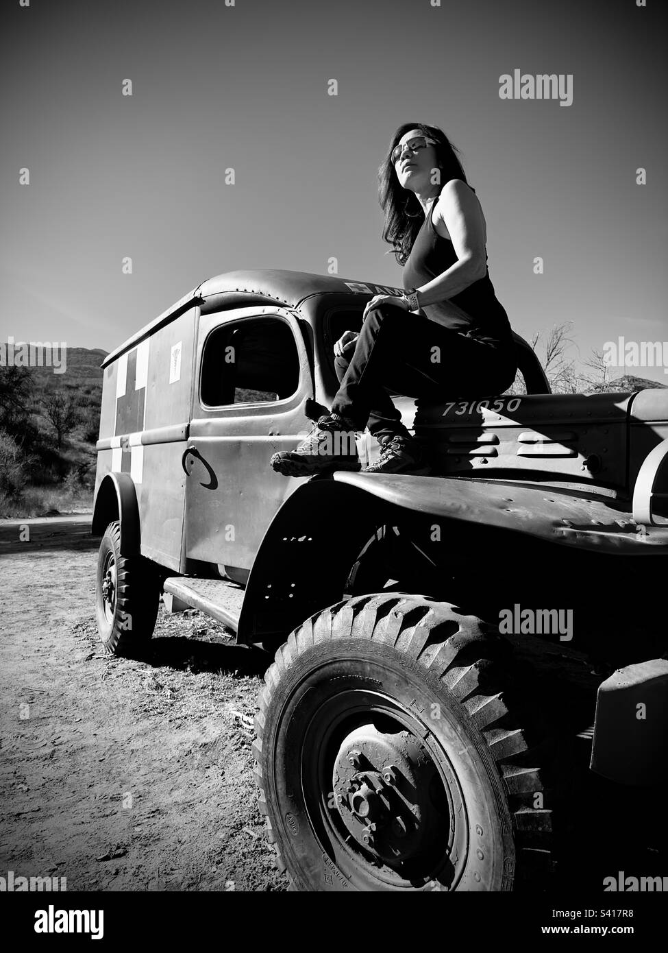 Army truck and Asian American woman Stock Photo