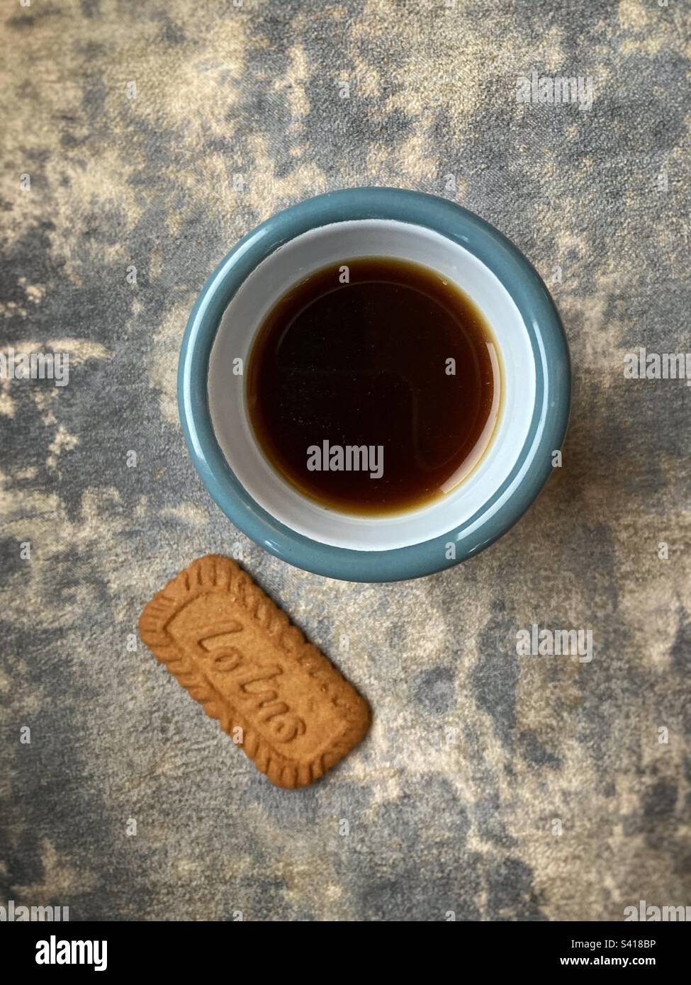 Cup of black coffee and a biscuit - Smartphone Captured Stock Image
