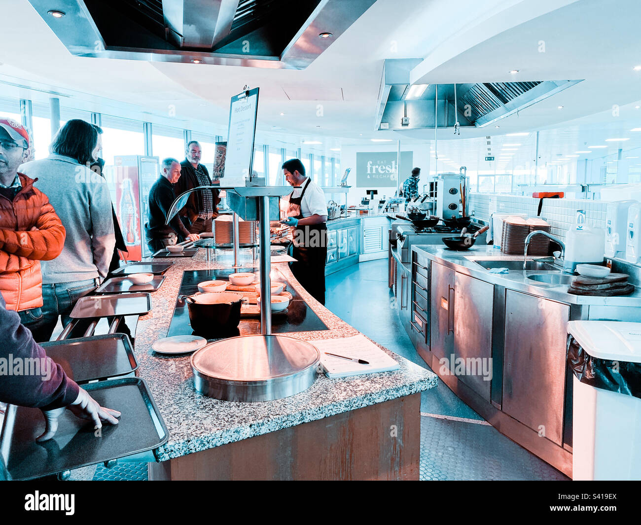 People queuing in the office canteen. - Smartphone Captured Stock Image