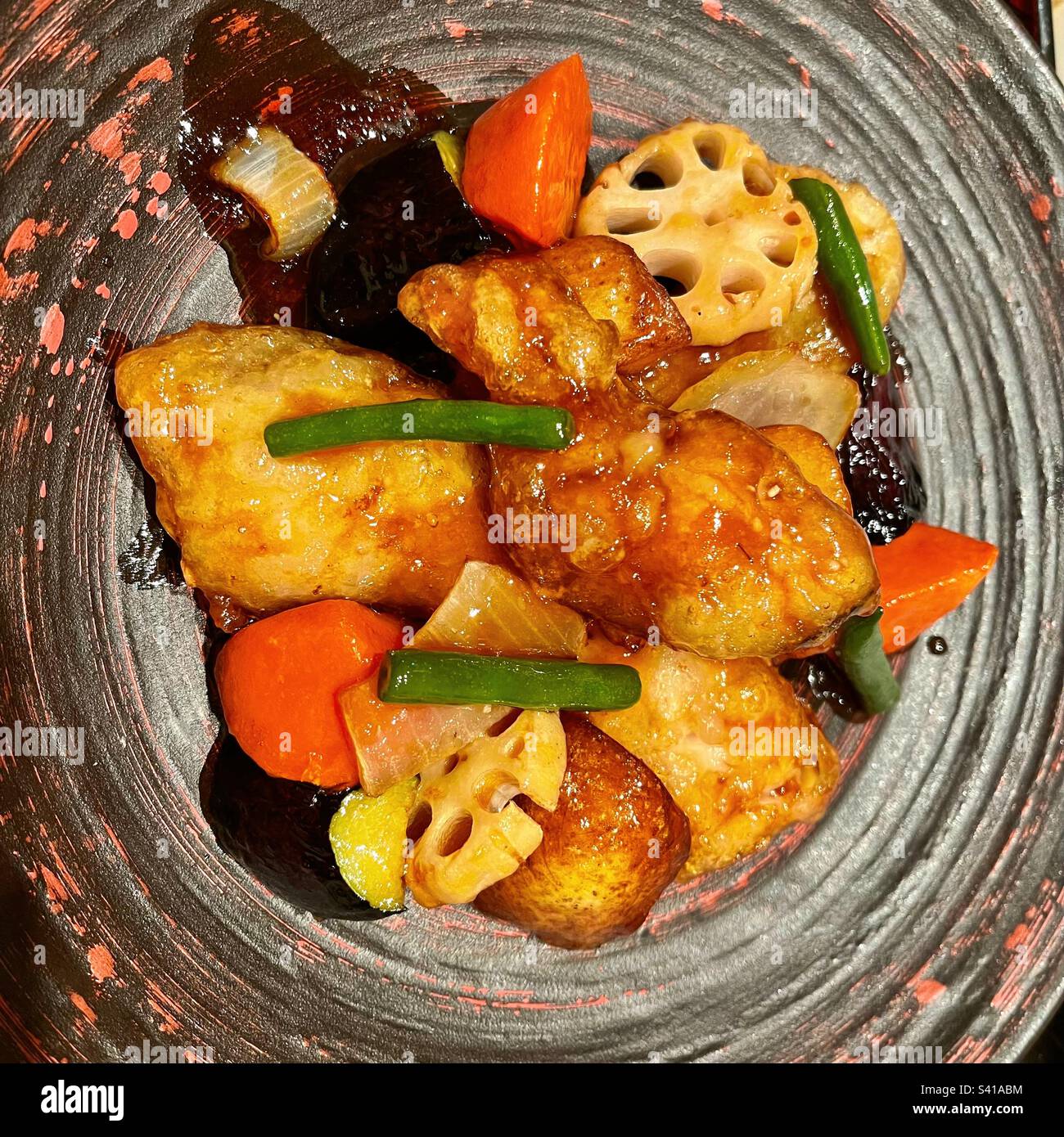 Japanese deep-fried cod and colorful vegetables with black vinegar ...