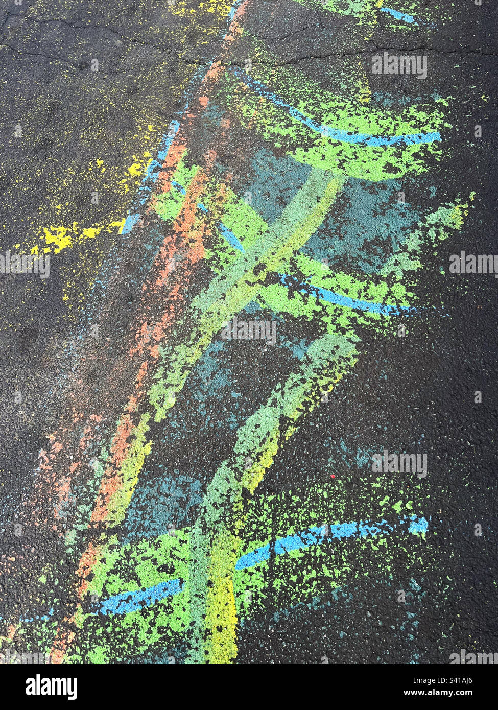 Colorful fading paint and markings on the asphalt of a parking lot in New Jersey, USA. - Smartphone Captured Stock Image