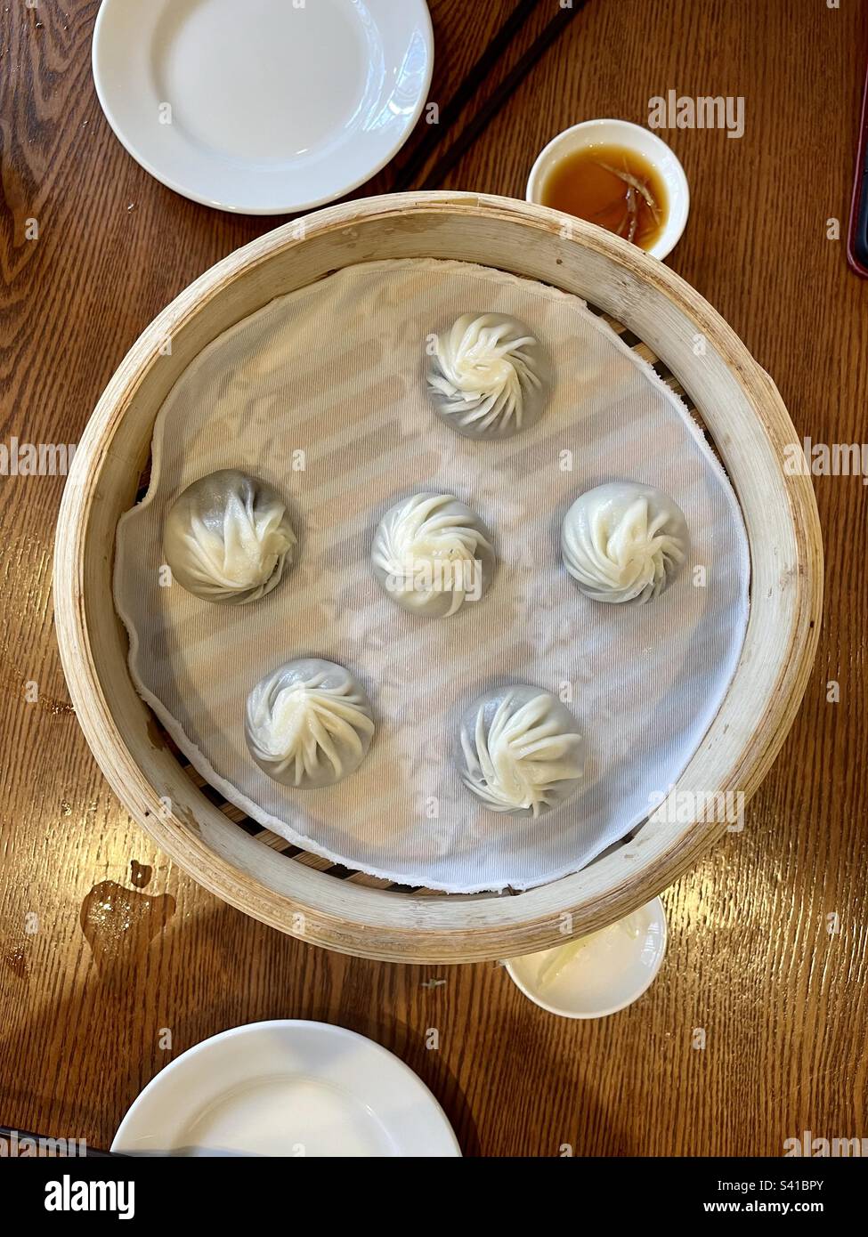 Steamed dumplings in wooden steam basket Stock Photo Alamy