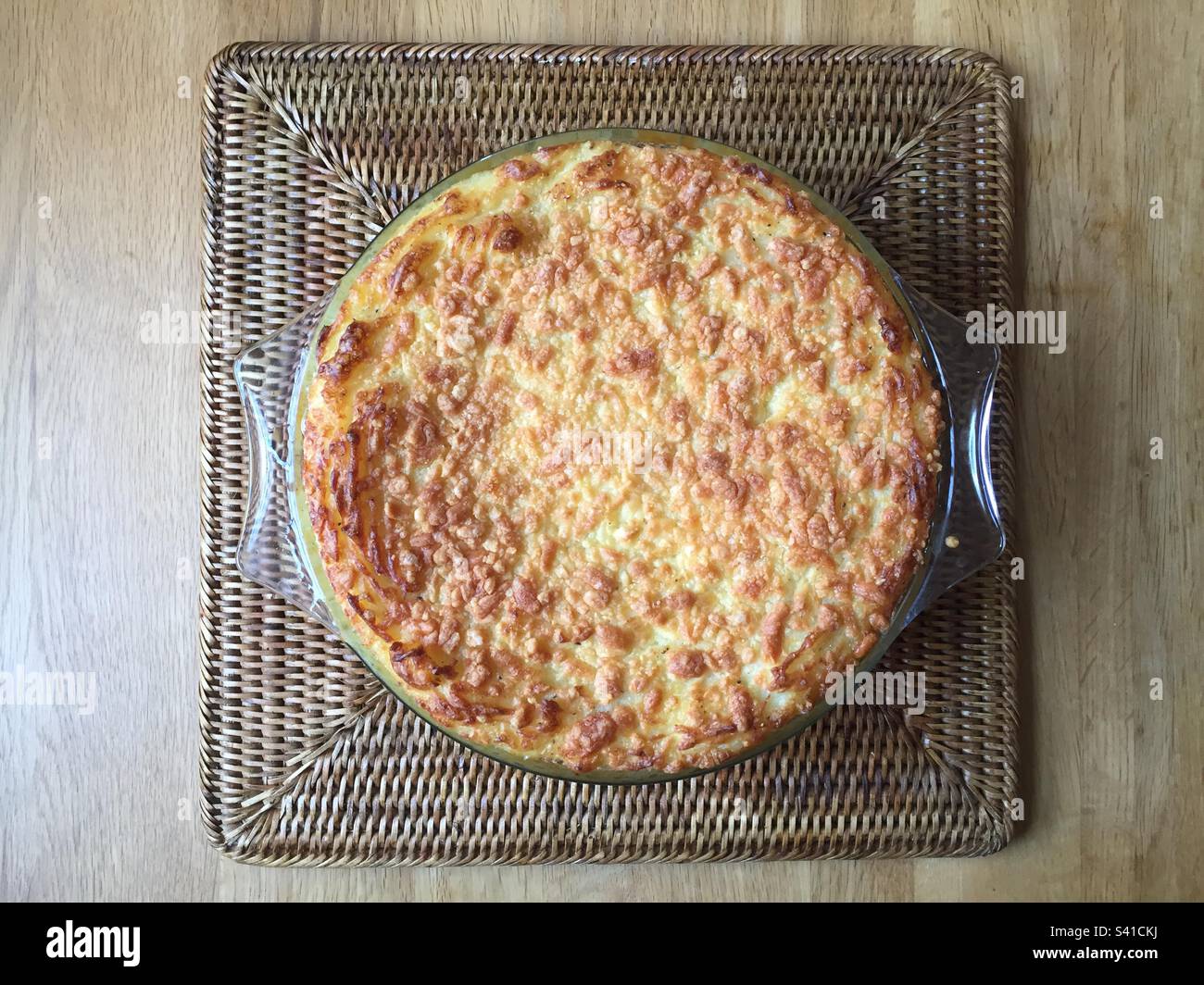 Mashed potatoes with grated cheese on top, in a glass casserole dish, baked in the oven till golden brown. Pic 1 - Smartphone Captured Stock Image