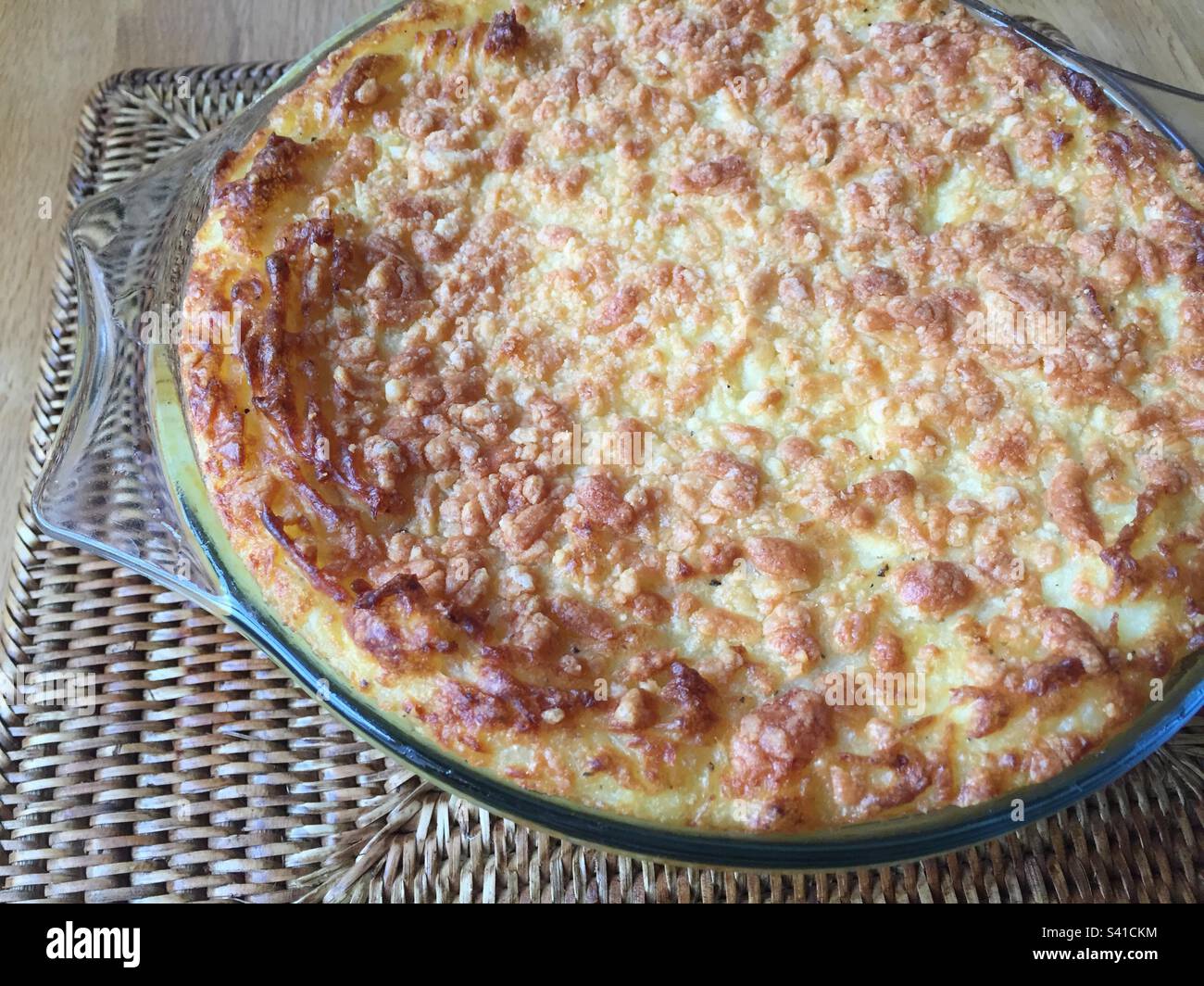 Mashed potatoes with grated cheese on top, in a glass casserole dish, baked in the oven till golden brown. Pic 5 - Smartphone Captured Stock Image
