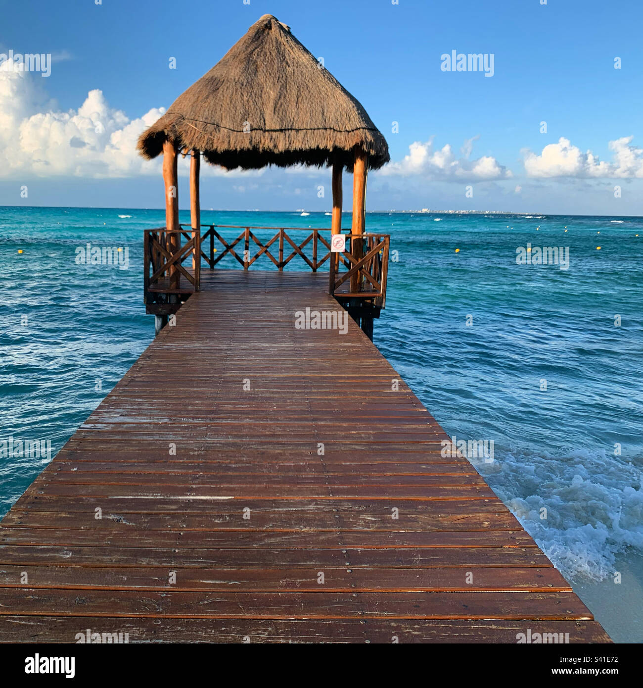 December, 2022, Palapa-covered pier, Punta Cancun, Cancun, Quintana Roo, Mexico - Smartphone Captured Stock Image