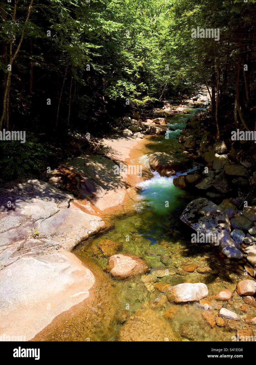 River at The Flume Gorge in Franconia Notch State Park, Lincoln, New Hampshire viewed from trail - Smartphone Captured Stock Image