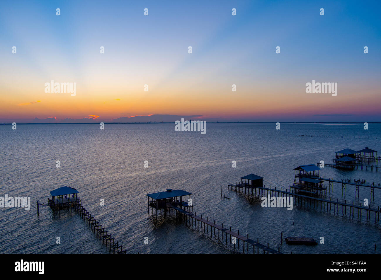 Piers on Mobile bay at sunset - Smartphone Captured Stock Image