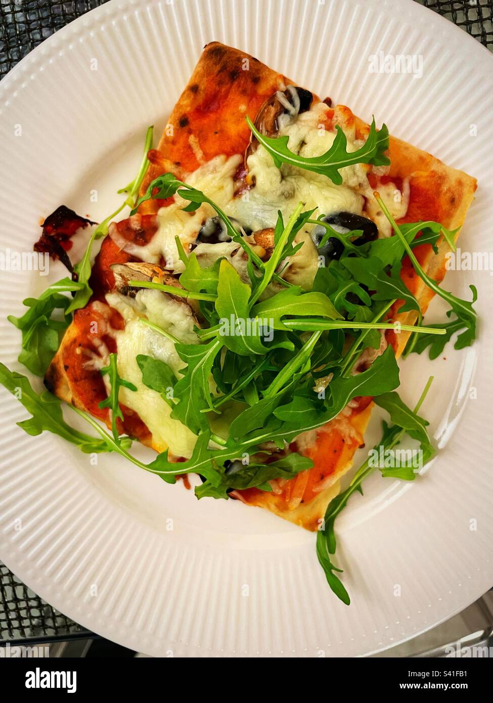 Flat Lay Of A Square Of Freshly Baked Pizza With Black Olives flat-lay-of-a-square-of-freshly-baked-pizza-with-black-olives