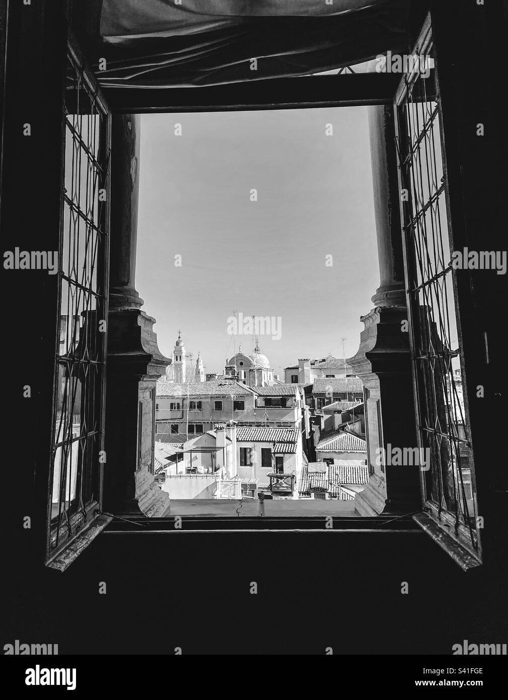 View of Venice cityscape from a window of the Palazzo Ducale in black and white - Smartphone Captured Stock Image