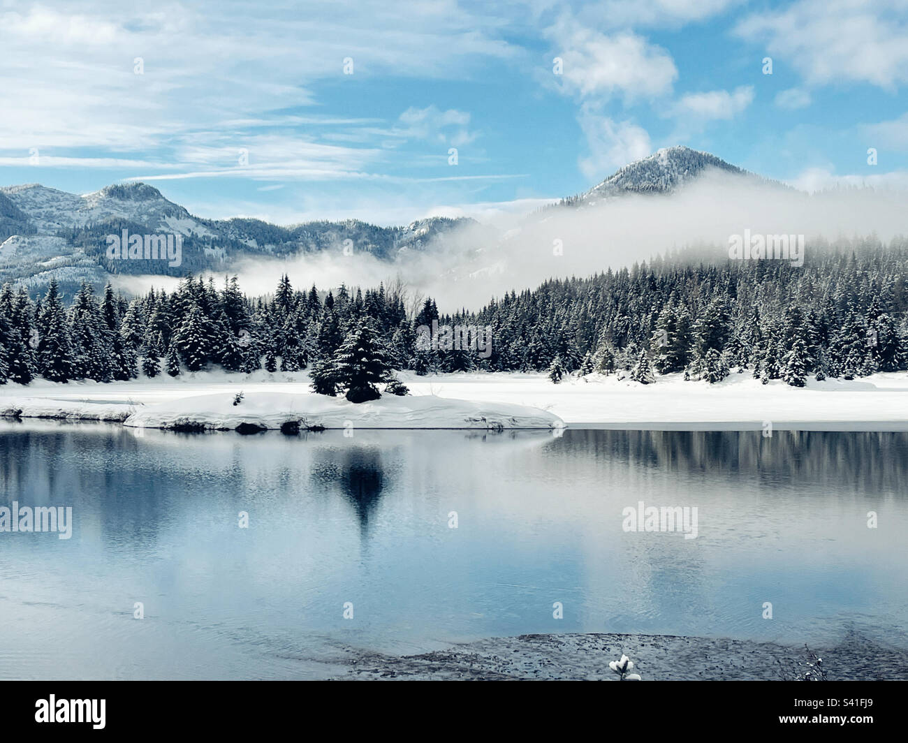 View to Snoqualmie pass from Gold Creek pond in Cascade mountains - Smartphone Captured Stock Image View to Snoqualmie pass from Gold Creek pond in Cascade mountains - Smartphone Captured Stock Image