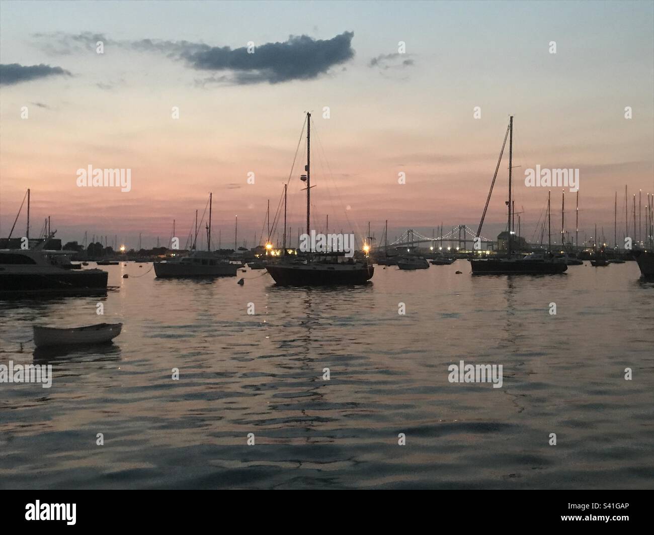 Sailboats at dusk in Newport Harbor Stock Photo - Alamy