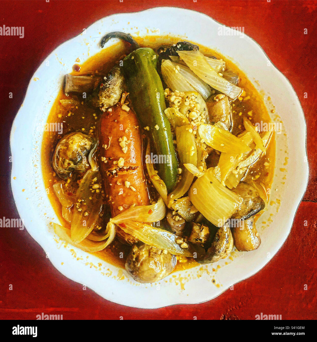Mushrooms with chile verde and chorizo sausage in a home in Mexico - Smartphone Captured Stock Image