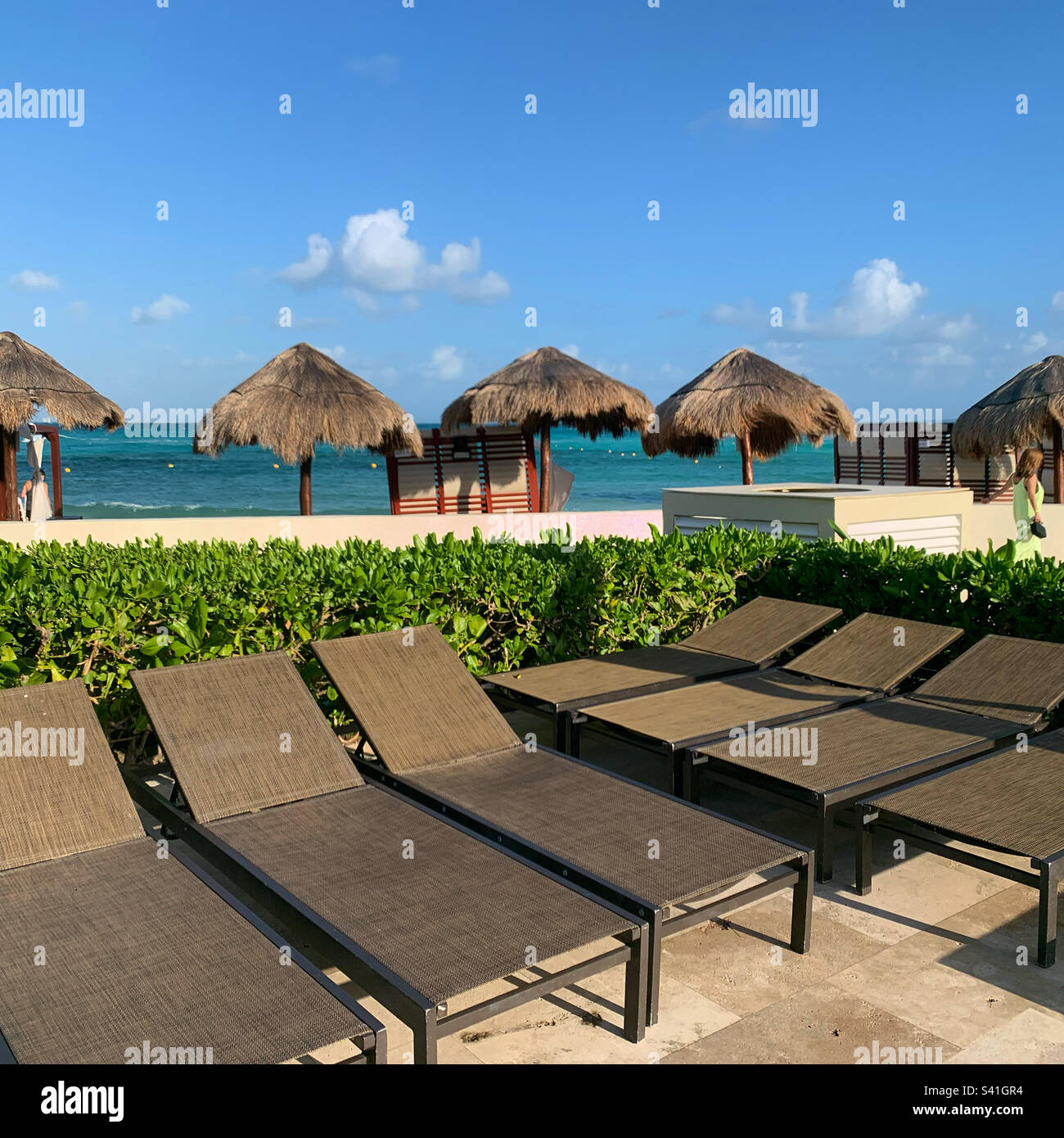 Lounge chairs at the pool, beach in the background, Hyatt Ziva Cancun, Punta Cancun, Hotel Zone, Cancun, Quintana Roo, Mexico - Smartphone Captured Stock Image