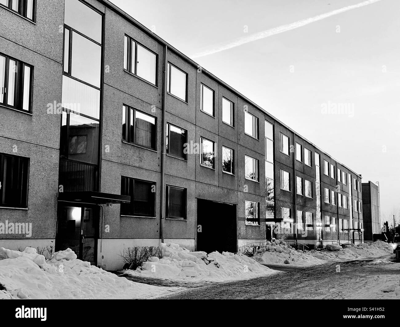 Black and white monochrome low residental apartment house building facade exterior 60’s architecture - Smartphone Captured Stock Image