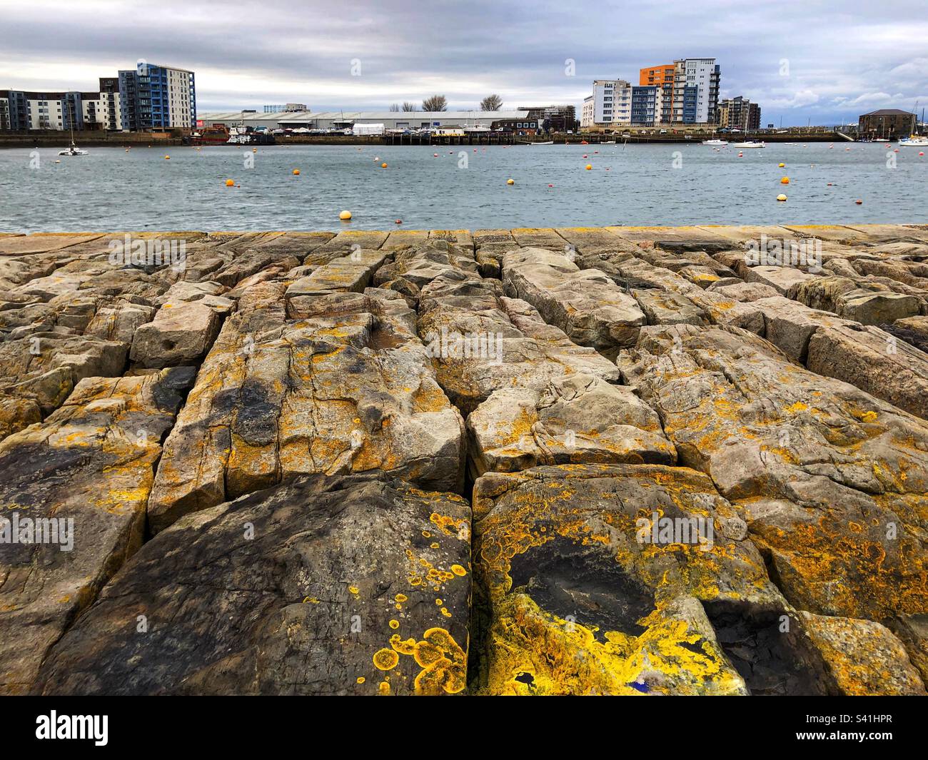 View from Granton breakwater to the harbour and modern building development, Edinburgh Scotland Stock Photo