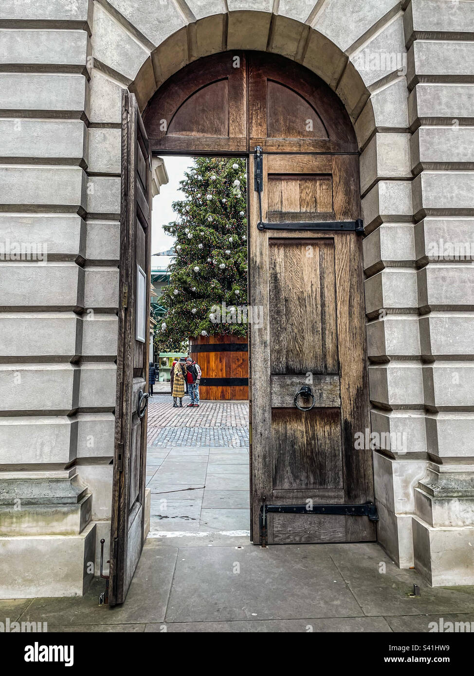 Covent Garden Christmas tree through an arched doorway - Smartphone Captured Stock Image