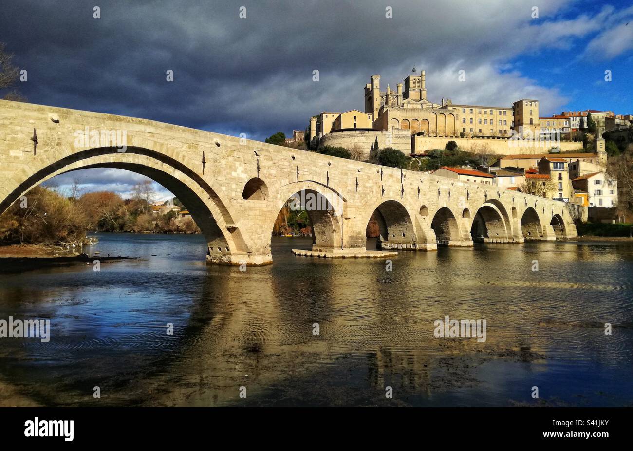 The old bridge and the St Nazaire Cathedral in Beziers. Occitanie, France - Smartphone Captured Stock Image