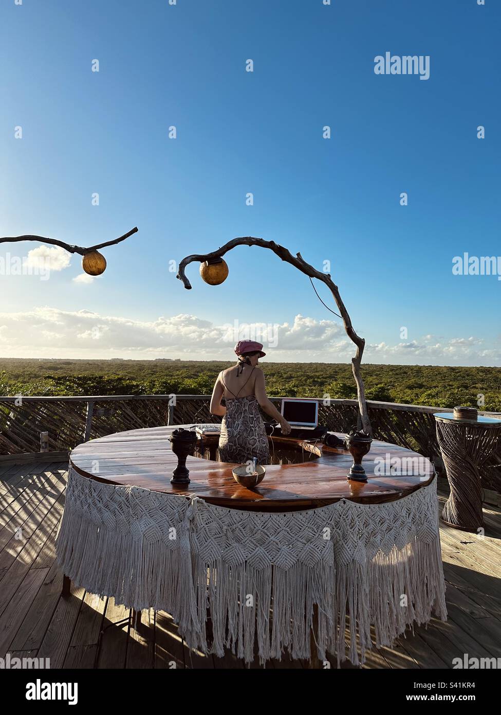 A DJ playing music against the forest in Azulik, Tulum, Mexico Stock