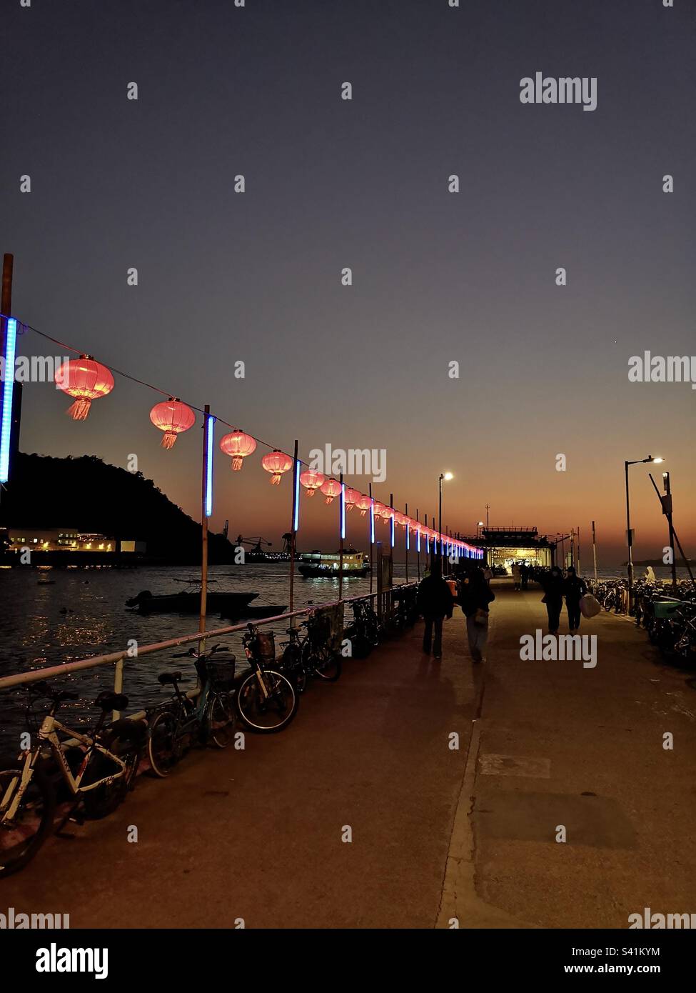 Chinese New Year lanterns decorating the pier at Yung Shue Wan in Lamma island, Hong Kong. - Smartphone Captured Stock Image