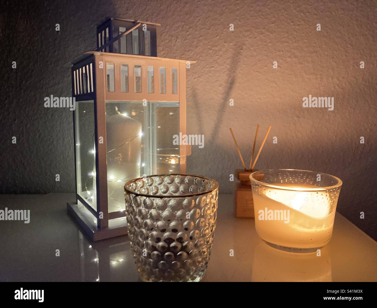 Cozy candle lights Stock Photo Alamy