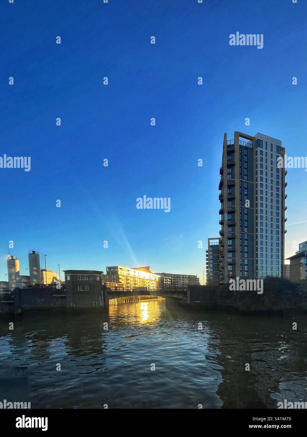 Deptford Creek as it flows into the River Thames in South East London. High rise towers replace industrial landscapes - Smartphone Captured Stock Image