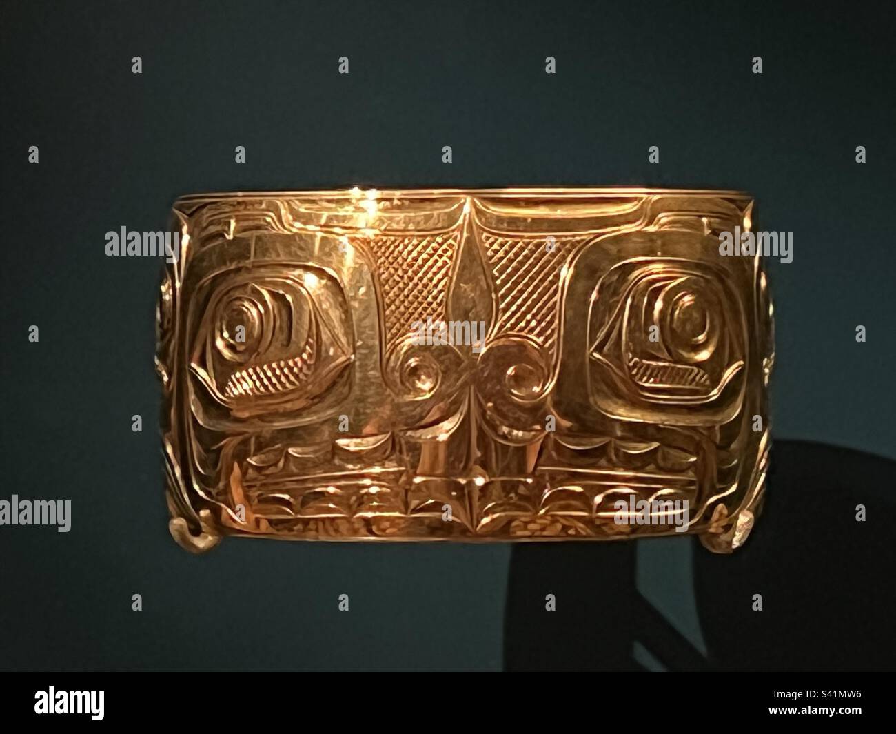 Namgis, West Coast Native American Gold Bracelet, in Exhibit at the American Museum of Natural History - Smartphone Captured Stock Image