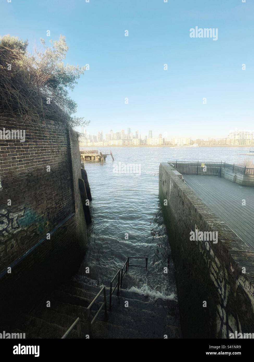 Steps into the River Thames by the site of the old naval dockyard, Deptford until the 19th century, water stairs were a common sight on the banks of the Thames essential for public transportation. - Smartphone Captured Stock Image