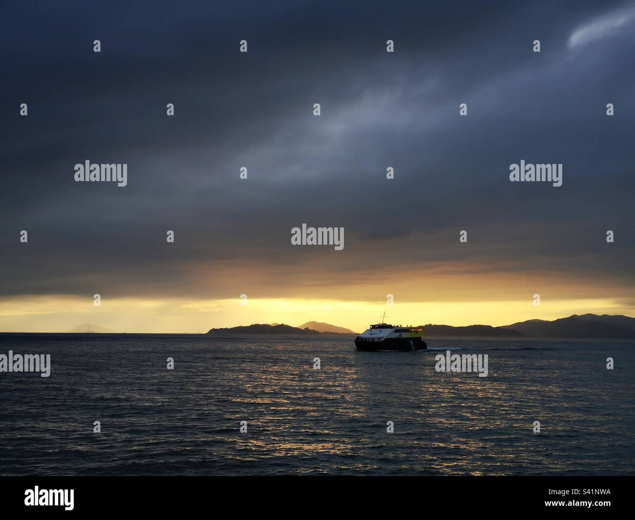 Lamma island ferry arriving at the Yung Shue Wan pier. - Smartphone Captured Stock Image