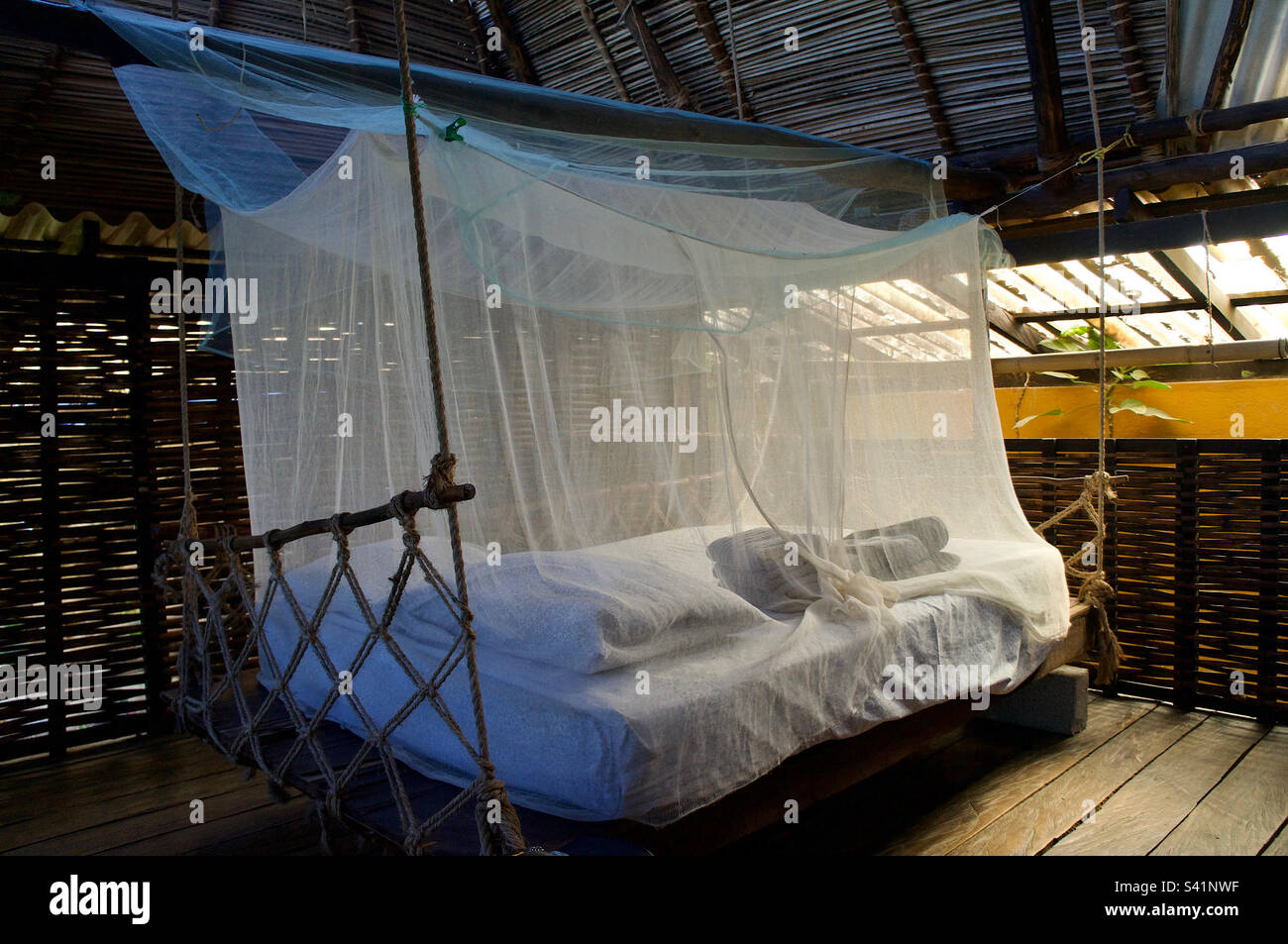Mosquito net covered floating bed. - Smartphone Captured Stock Image