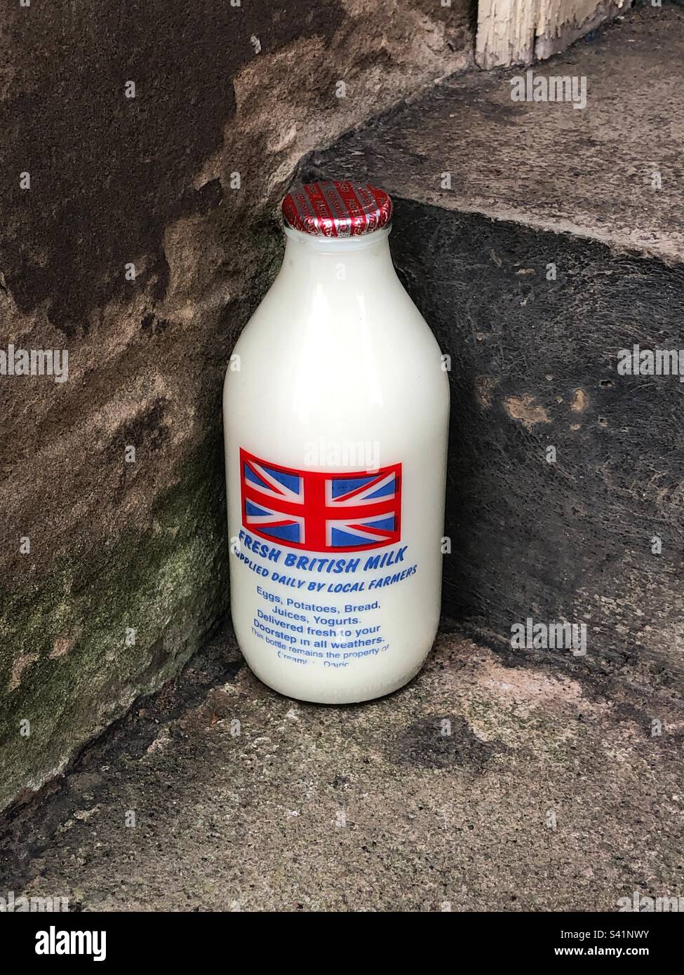 Pint of milk delivered on doorstep, UK - Smartphone Captured Stock Image