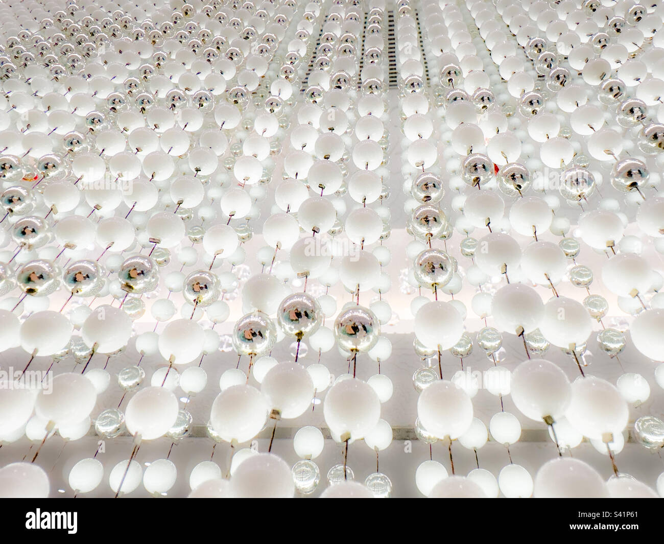 Curtain of white back-lit decorative beads - Smartphone Captured Stock Image