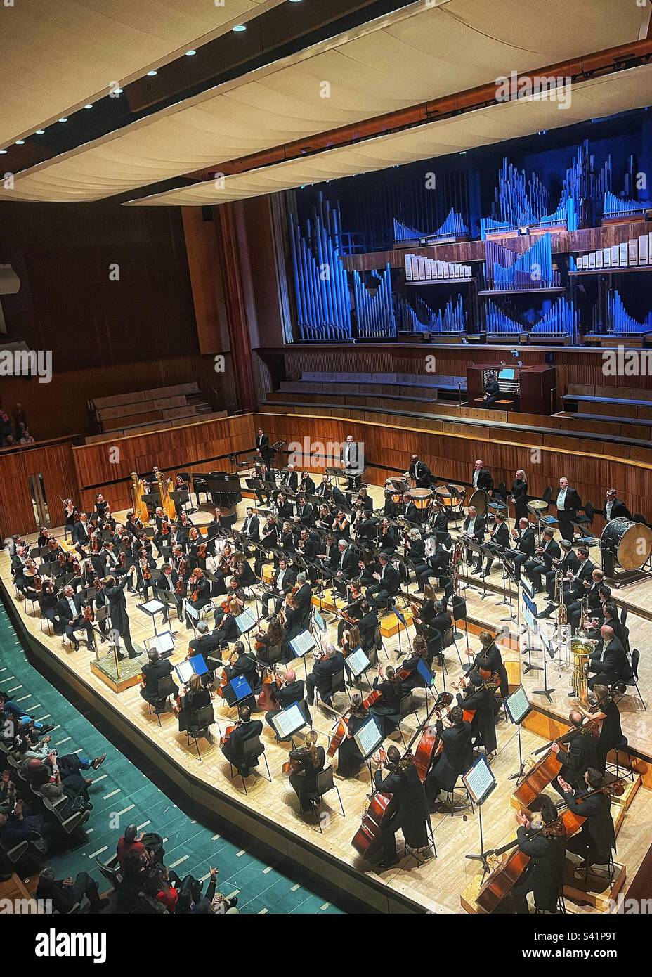 Vasily Petrenko is conducting the Royal Philharmonic Orchestra in the Royal Festival Hall in London - Smartphone Captured Stock Image