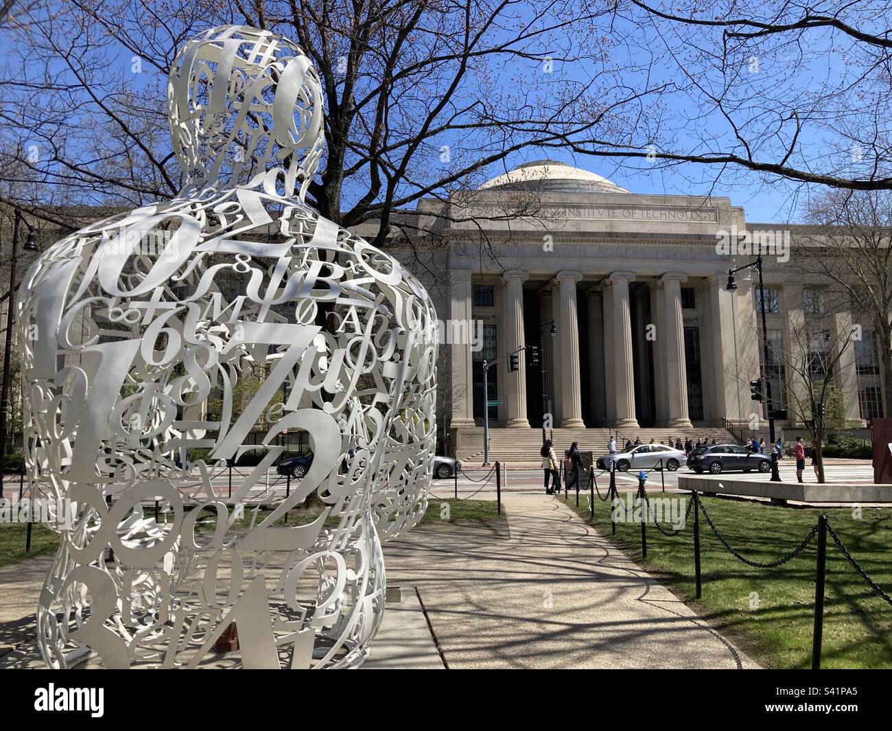 Sculpture on Massachusetts Institute of Technology (MIT) campus. The sculpture is titled Alchemist by artist Jaume Plensa and consists of mathematical symbols in the shape of a human form. - Smartphone Captured Stock Image
