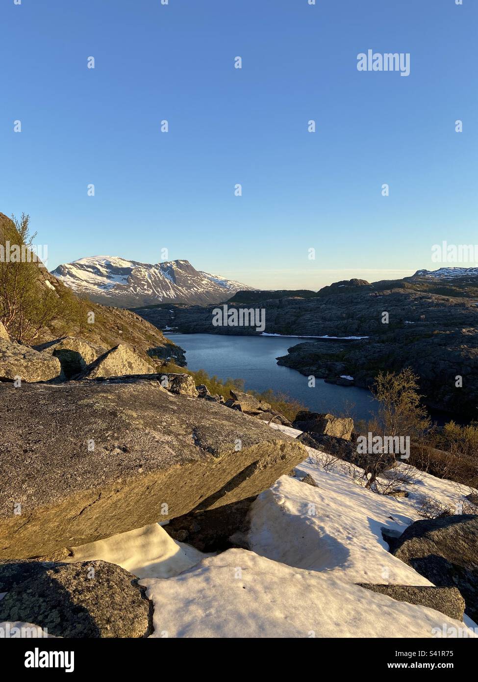 Hiking near Narvik, Northern Norway. Midnight sun is shining, there is still some snow here and views are beautiful. - Smartphone Captured Stock Image