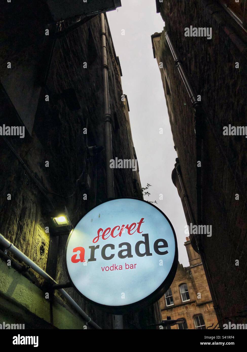 Secret arcade vodka bar in alley - Smartphone Captured Stock Image