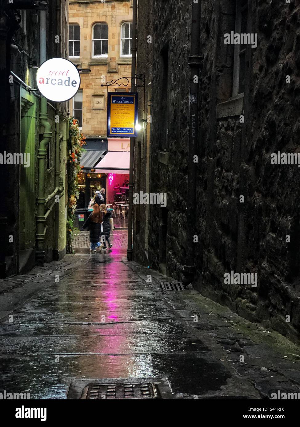 Secret arcade vodka bar in alley - Smartphone Captured Stock Image