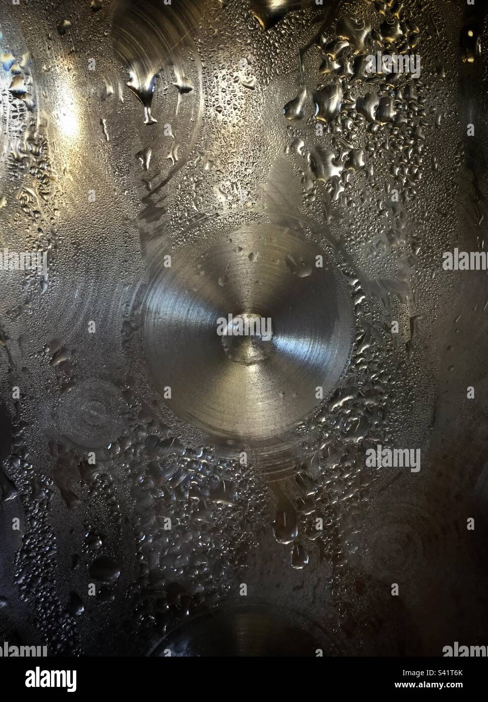 Temperature control causing condensation on a stainless steel tank in a winery, Catalonia, Spain. - Smartphone Captured Stock Image