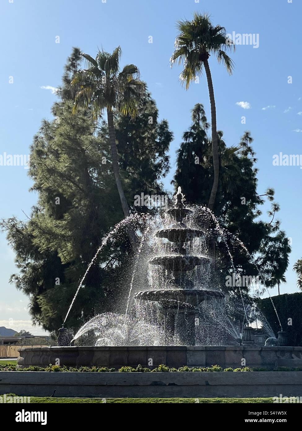 Scottsdale, Arizona, backlit water spray, Four tier fountain, palm tree