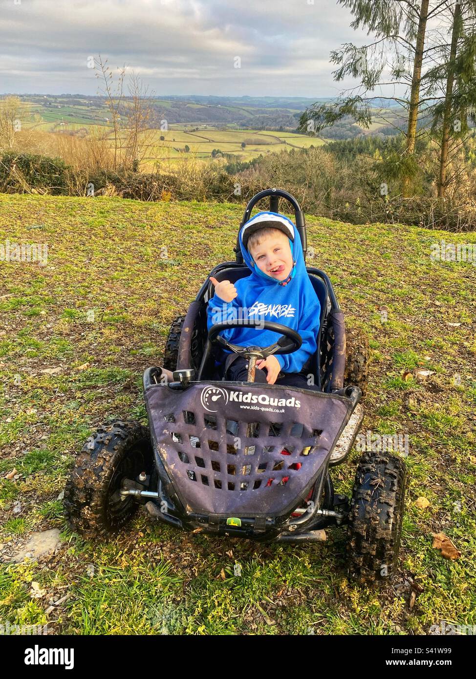 Six year old boy in an electric gokart. North Devon, England, United