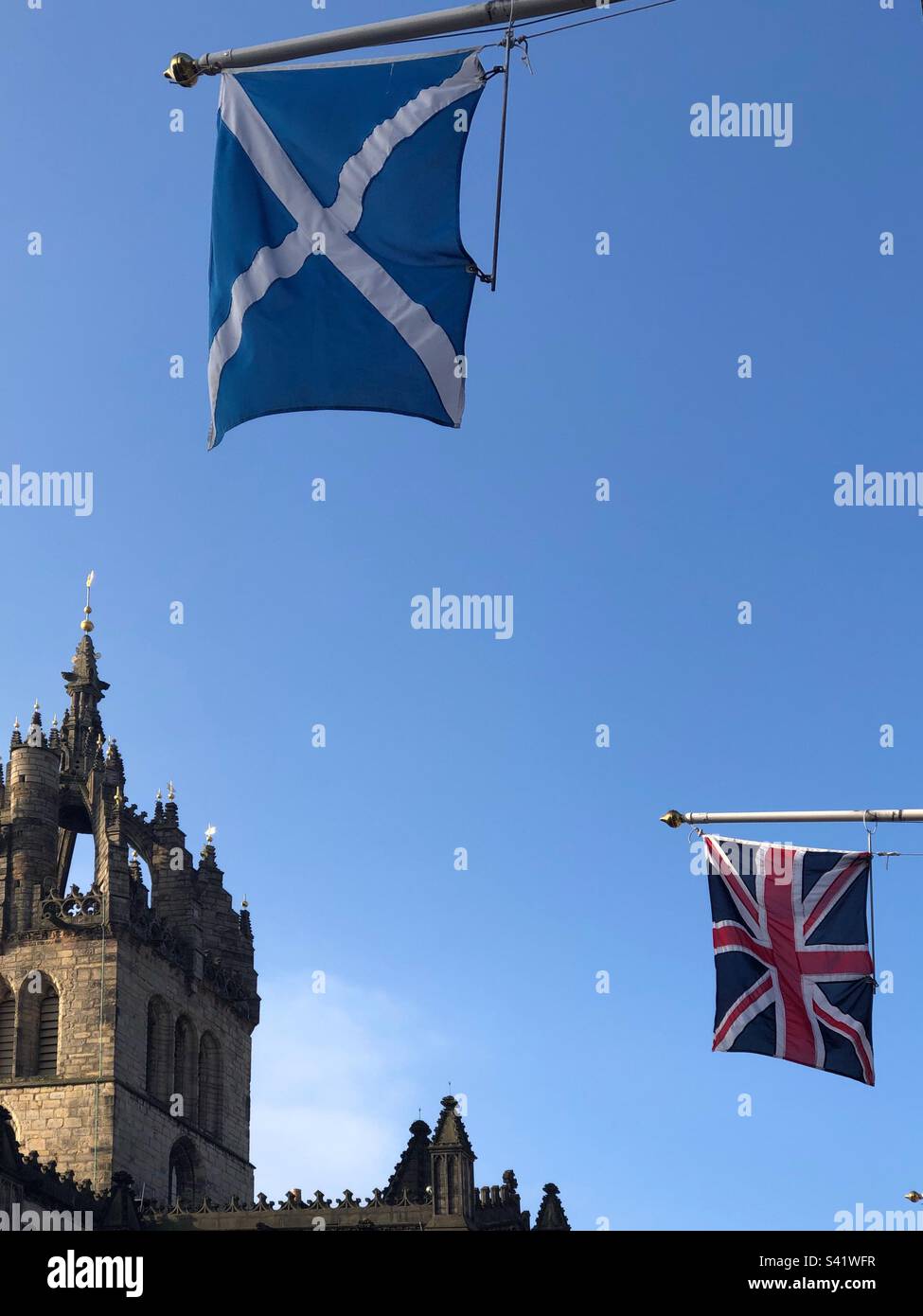 St Giles Cathedral with the Saltire and Union Jack flags outside the City Chambers, Royal Mile, Edinburgh, Scotland - Smartphone Captured Stock Image