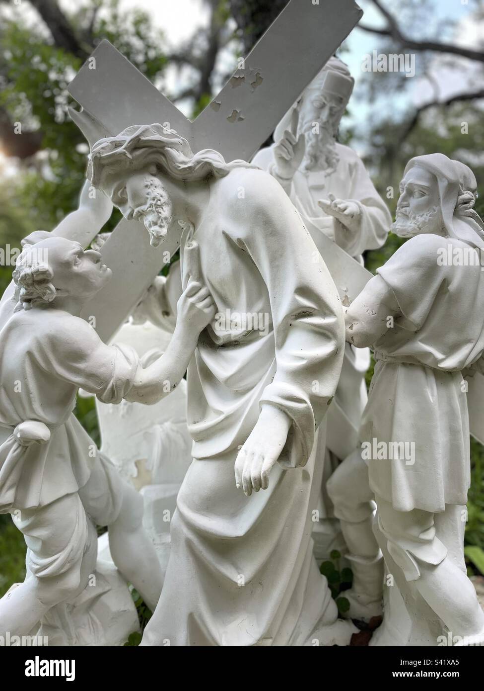 Portrait, Stations of the Cross, 2nd station, Jesus presented with Cross, eye to eye contact Jesus and guard, accusing official in background, white nearly life-size statues Stock Photo